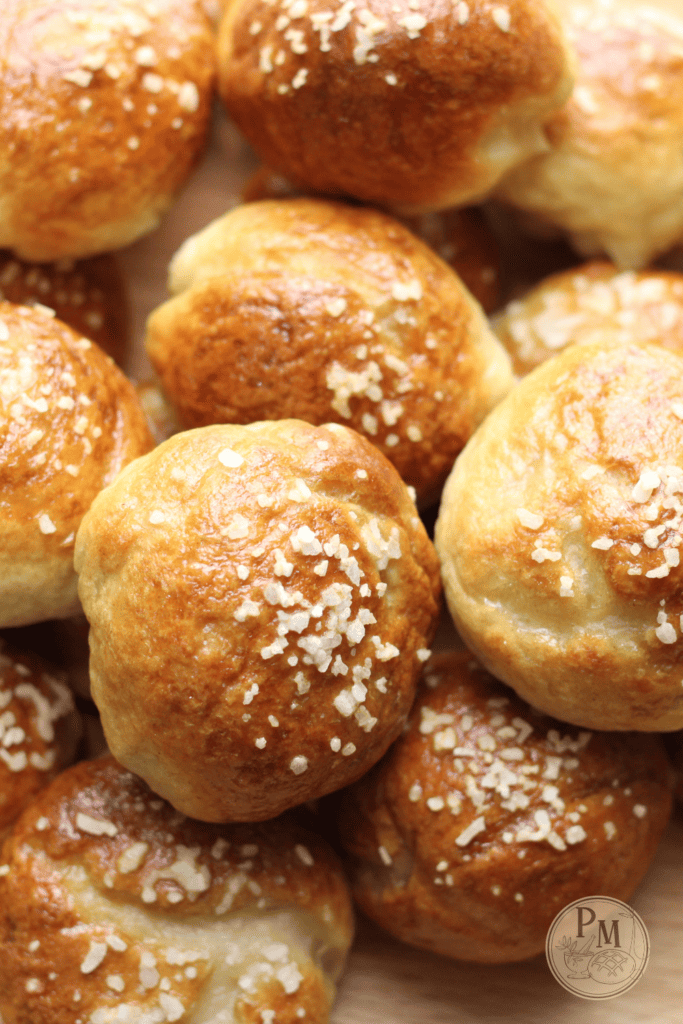 pile of sourdough discard pretzel bites on a butcher block counter